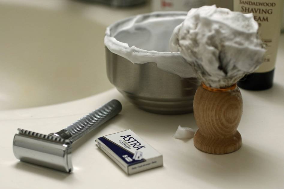 Close-up of a classic shaving brush with natural bristles and a polished handle
