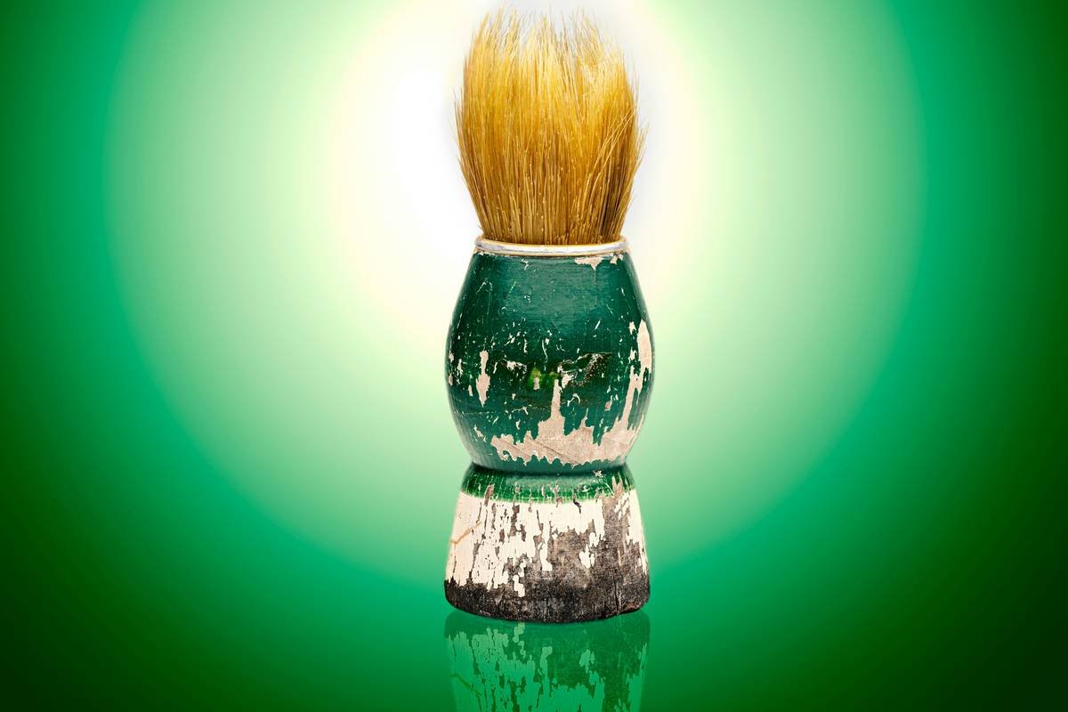 Close-up of badger hair shaving brushes showing natural bristle texture and ergonomic handle